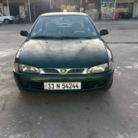 بروتون ٢٠٠٢ • زيتوني مصبوغ • رقم بغداد