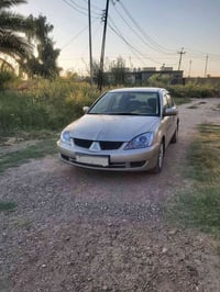 لانسر ٢٠١٠ • ١٦٠٠ سي سي • ١٥٥ ألف