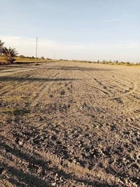 الأرض للبيع مساحة  14 دوانم  واجه210 متر  ونزال  167 متر    شارع 15   ...