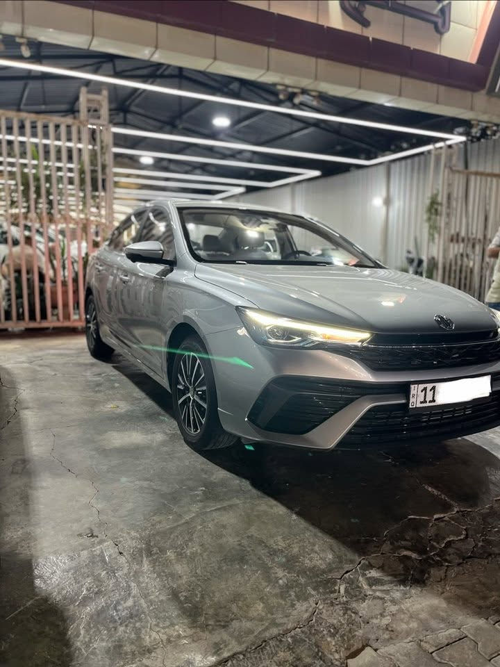 🚗 السلام علكيم للبيع او المراوس حسب القناعه
mg 5 motor ضمان صيانه تبديلات الدهن مجاني بانزين 
رقم السيارة بغداد 
  🛣️  المسافة المقطوعة      - 4000   الف كلم فقط 
------------------------------------------------------------ 
✅ المواصفات:   
✅ الموديل: 2025
✅ الحالة: كفاله عامه من كلشي سياره بحالة الزيرو 
🔹 قطعتين تبريد
🔷وضعيات القياده Dirve mod 
🔷 هند بريك بصمه
🔷 فتحه سقف 
🔷 داخل جلد لون ابيض 
🔷 داخل خمس كامرات 
🔷 شاشه وسطيه تدعم car play
🔷 مثبت سرعه
🔷 كراسي كهرباء 2
🔷جامه سايق AUTO 
🔷كراسي تدفئه
🔷 باقي المواصفات معروفة 
ملاحضة / السيارة اعلى مواصفات MG فول الفوول 5 كامرات 
📍 السيارة متوفرة في بغداد  
📞 للأستفسار الاتصال ***********
