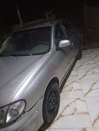 نيسان سني • ٢٠٠٣ • ضربه خلفي يمين