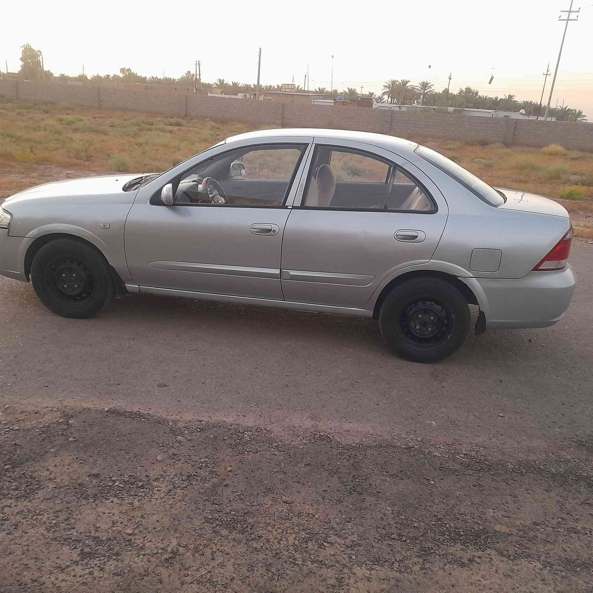 نيسان سني كوري ٢٠٠٧ باسمي رقم انكليزي جديد وهزه جديده محرك وكير وتبريد جاهزه  بيها صبغ بنيد وجاملغ خلفي اثر جراد كل الدواخل مكفوله مكانها التاجي ***********  كير محرك تبريد ممتاز
