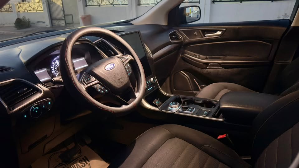 FORD EDGE SE 2022 AWD
المحرك: 4 سلندر EcoBoost 20 توربو.
نيظام الدفع: AWD 
​الشاشة الترفيهية: شاشة عمودية تعمل بنظام SYNC 4A.
​الاتصال: دعم لاسلكي لنظامي Apple CarPlay و Android Auto.
​المقاعد: قماشية مريحة
​نظام التحذير من التصادم الأمامي مع الفرملة التلقائية في الطوارئ.
​نظام الحفاظ على المسار والتحذير عند الخروج منه.
​نظام مراقبة النقطة العمياء (BLIS) والتنبيه لحركة المرور الخلفية.
​كاميرا رؤية خلفية وحساسات ركن خلفية.
​الإضاءة: مصابيح أمامية وخلفية تعمل بتقنية LED.
​المرايا: مرايا جانبية كهربائية .
سيارة بدون صبغ بها جاملغ سائق مبدل بلادي و شبر بارد بالنبيد سيارة رقم اربيل . سيارة موجودة في أربيل. 
سعر 155 

رقم موبايل ***********
