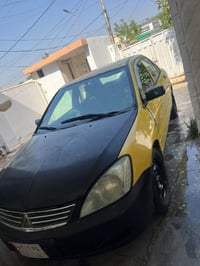 لانسر ٢٠١٠ • كامله • رقم بغداد