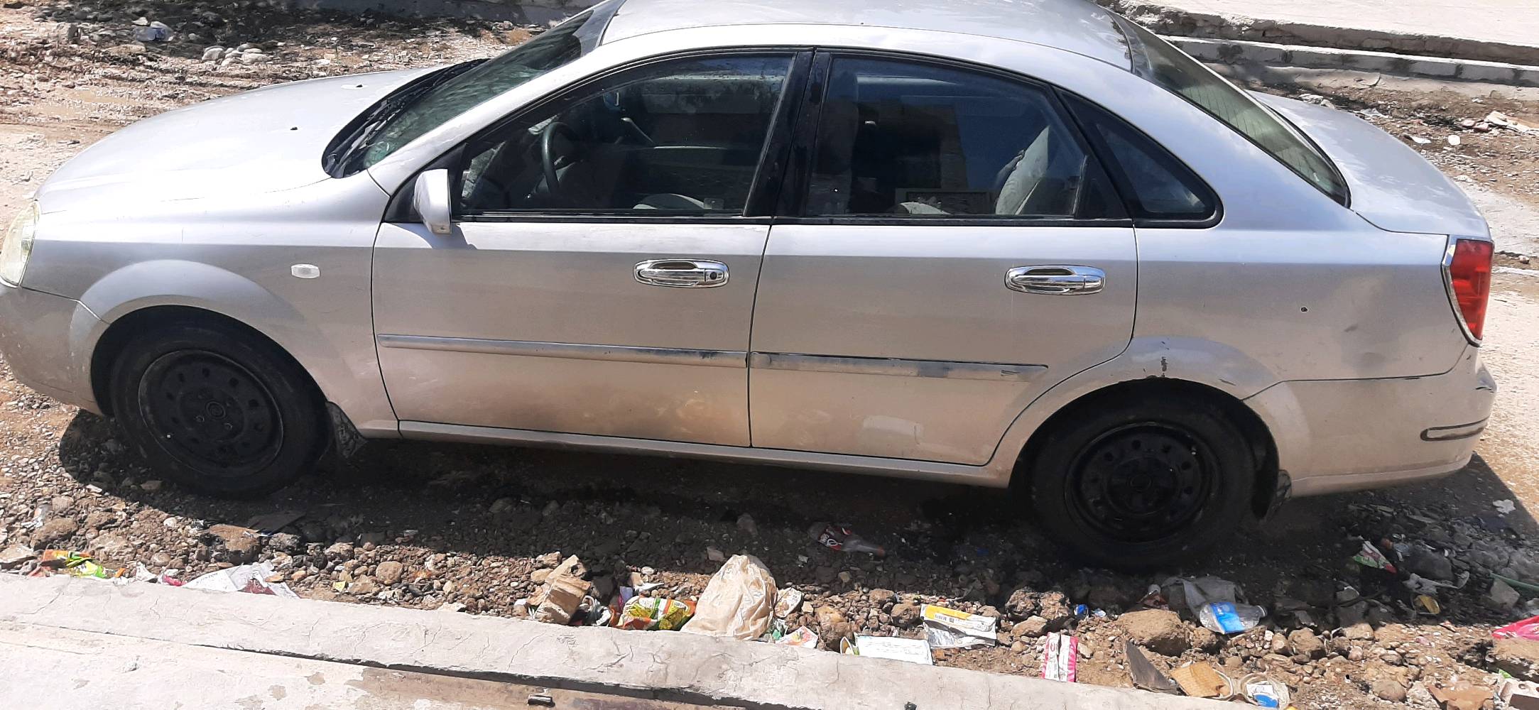 فورنزا موديل ٢٠٠٧ مكينه وكير خير من الله تبريد شغال السياره بسمي تحويل ثاني يوم السياره عوزه صبغ فقط والصدر الخلفي ٥٠% مكاني بغداد ***********