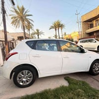 نيسان تيدا سياره بيه قطع صبغ ابيع حزام رقم بغداد نكليزي سنويه جديده بس...