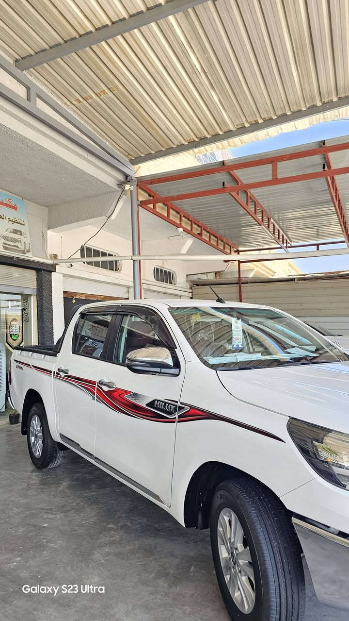 #معرض #الظلال المركزي 
بيك اب هايلوكس ناصي 2026
      🎗HILUX🎗TOYOTA
 🎈اوتماتيك  زيرو 🎈 
            وكالة SAS
⚠️الصيانه لمدة 3 سنوات او 100 
الف كم 
مرقم لوحات .أربيل  
 #موديل :2026

مواصفات : فول باب اول بلادي بدون أضافات أو سستم
المحرك : 2700vvt.i . V4
اللون : أبيض
المواصفات 
مرايا شفط #كهربائي/ 
#شاحن وايرليس
🎗 مفتاح التشغيل بصمه .
🎗كيلو متر  عداد🎀 لكزز🎀 مختلف كليآ
🎗بطايان ثانوية مغلفة شواصي 4اطارات
🎗 دفع ثنائي . 2×4.
🎗 مصابيح اماميه auto
🎗 كشافات ( بروجكتور) 
🎗 شاشه كبيره.
🎗 كامره دواره .
🎗 ويل كب قياس 16 
🎗 مقاعد بقلاوة تبريد أصلي المقاعد الأمامي  
🎗 زر مساعد نزول منحدر.
🎗زر مانع للتزحلق vsc قفل اكسل .
🎗 زر مساعد دوران dac .
🎗 سستم ايرباك متكامل .
🎗 شاحن واير لس .
🎗 مري AUTO قابله للطي.
🎗 اشاير بالمري .
🎗 ثلاجه وسطيه .
🎗 حساس خلفي 
🎗 مخرج للطاقه A 10  مخرج AUX&USB.
🎗مخرجHDMI L 
🎗 تحكم مقود متعدد لاستخدامات.
____________________________________
ملحقات السياره
🔖 فرشات ارضيات land cruiser prado
🔖 صندوق اسعافات اوليه 
🔖 مطفأة حريق 
🔖كيج ايطارات 
🔖 مثلث
🔖 عده 
🔖 جك 
🔖 سبير نوع ويل كب 
🔖كتيب ضمان والصيانه
🔖بصمه اضافيه
🔖نفاضه
 🦅معرض ألظلال المركزي 🦅

اي استفسار عن طريق الاتصال  أو الواتساب فقط 

واسط الصويرة شارع المعارض الرئيسي 
***********    واتساب

***********    واتساب
