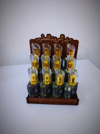 عطور مركزه • ٤ نكهات • ستاند مجاني