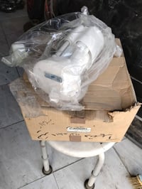 عبوه بانزين نيسان تيدا جديد أصلي شركه وكاله 07742455181