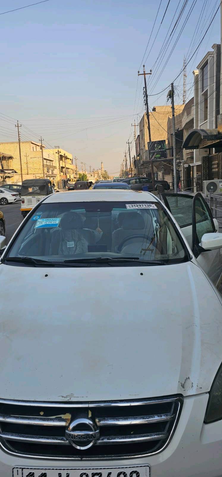 نيسان التيما رقم بغداد انكليزي باسم زوجتي السعر 70وبي مجال قطعتين صبغ دون معجون بنيد منكرش خفيف حدادية جديدة دبلات جديدة باتري جديد تخم تاير جديد غرفة نظيفة تبريد قطعتين امامي خلفي لايت زنون عالي ناصي مال مونيكا مكاني بغداد محمودية
شنو سنة الموديل وعدد الكيلومترات الممشاية؟: 
2007
شنو نوع المكينة والكير بالضبط، وهل بيها أي ملاحظة على القير أو المكينة؟: 
2400
هل السيارة عليها صبغ غير المذكور أو بيها رش/معجون بغير الأماكن المعلنة؟: 
لا
وين مكان السيارة للتفقد؟ وهل السعر قابل للتفاوض بشكل بسيط لو نهائي؟: 
بغداد محمودية نعم قابل للتفاوض 
شنو وضع التسجيل والملكية: رقم بغداد إنكليزي وباسم زوجتك، وهل الأوراق كاملة وجاهزة للنقل؟: 
نعم
