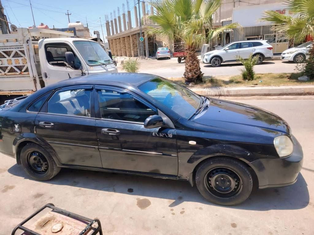 السلام عليكم فورنزا موديل 2006 رقم بغداد دولي مشروع وطني  مكفوله من ضربه صبغ مابيهه اوتماتيك جاهزة من كلشي كير مكينه حداديه نقص  تبريد الراديتر موزينه. فقط سعرهه 50 وبيهه مجال حك الجيه مكاني ذي قار الرفاعي.  تحويل او وكاله حاضر  اي وقت *********** الشطره, ذي قار
