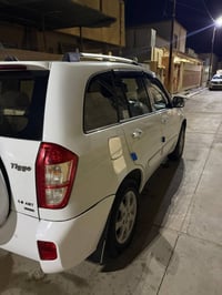 تيكو ٢٠١٣ • محرك ١٨٠٠ • جلد بيج فتحة