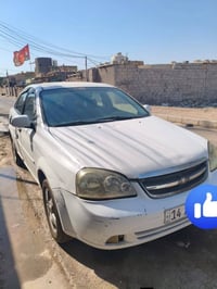 اوبترا موديل 2011 لون ابيض رقم بصرة انگليزي بأسمي سنوية لل 2031 وهزة ج...