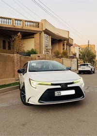 كورلا هايبرد • ٢٠٢٥ • داخل جلد أحمر