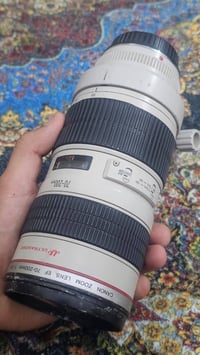 عدسه كانون 70,200 اصدار اول فتحه 2,8  نضافه 80٪ السعر خاص التواصل 0782...