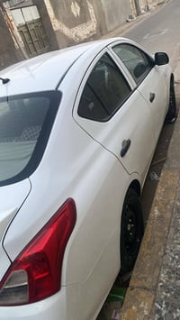 نيسان سني هندي موديل 22 ماشية 103 رقم بغداد انكليزي بأسمي السونار مرفق...