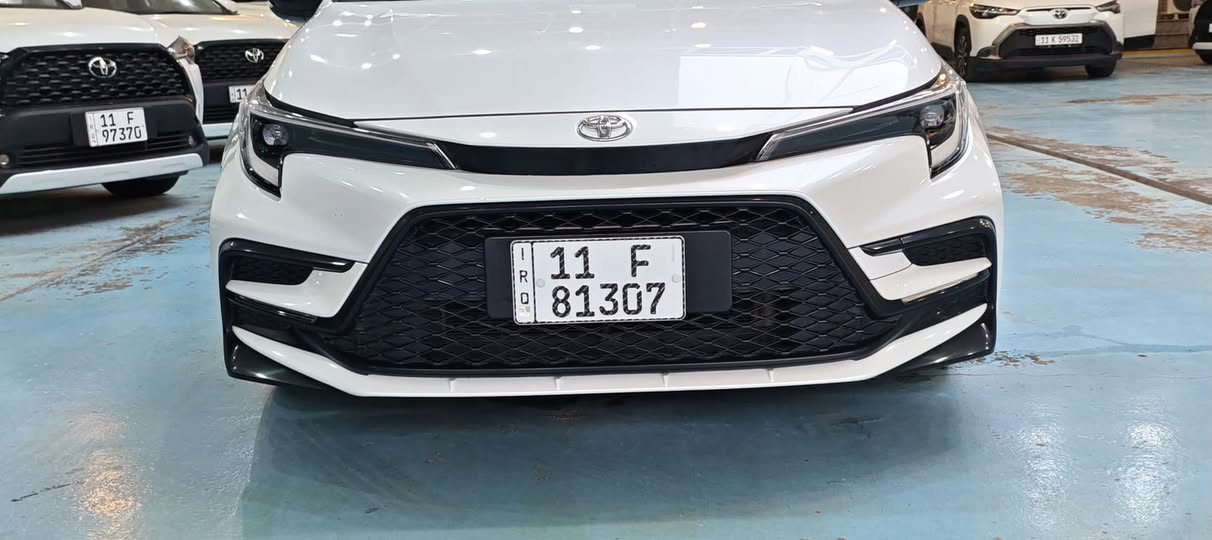 كورلاء بلاك ديشن موديل 2025خليجي سيارة بعدها بحاله الوكاله غراضها ما مفتوحة ماشيه ٢ الف  ).هايبرد بانزين
• التصميم الخارجي:
• فئة Black Edition الأصلية.
• جناح خلفي + مرايا جانبية + شعارات (سوداء ملكية).
• ويل كب أسود بلادي بتصميم رياضي.
• فتحة سقف (سلايد).
• إضاءة لايت زينون فاخرة.
• التقنيات والذكاء:
• شاشة وسطية متطورة + عداد ديجيتال بالكامل.
• كاميرا دوارة بدقة عالية.
• بصمة تشغيل كورلاء بلاك ديشن موديل 2025خليجي سيارة بعدها بحاله الوكاله غراضها ما مفتوحة ماشية٢  الف ).هايبرد بانزين
• التصميم الخارجي:
• فئة Black Edition الأصلية.
• جناح خلفي + مرايا جانبية + شعارات (سوداء ملكية).
• ويل كب أسود بلادي بتصميم رياضي.
• فتحة سقف (سلايد).
• إضاءة لايت زينون فاخرة.
• التقنيات والذكاء:
• شاشة وسطية متطورة + عداد ديجيتال بالكامل.
• كاميرا دوارة بدقة عالية.
• بصمة تشغيل + نظام الدخول الذكي.
• نظام (رادار + تحديد مسار + قيادة شبه ذاتية).
• هاند بريك كهربائي + أوتو هولد.
• الراحة والأمان:
• مقاعد جلد أصلي (تحكم كهربائي للمقعد).
• تحكم مقود كامل (جهتين) + وضعيات قيادة (Drive Mode).
• نظام أمان متكامل (فل سيستم إيرباك + مانع تصادم + مانع انزلاق).
سعر ٢٦ و٧٥٠ وبيه مجال شراي يتصل مكان بغداد 
الون الصدفي
***********
