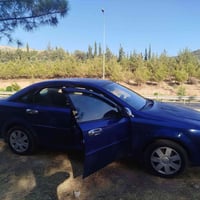 اوبترا 2008  اللون ازرق  -بيها قطعة صبغ جاملغ اليمين الخلفي وطخة  خفيف...