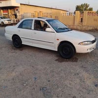 پڕۆتۆن • ٢٠٠٢ • مكيف