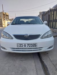 ٢٠٠٤ • سنوية باسمي • كوبون بنزين