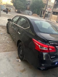 للبيع نيسان سنترا S 2019 رقم بغداد الانكليزي الجديد بسمي السيارة  ثلاث...