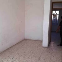 مقابل جسر الكريعات • ٧٠م • ٢ غرف