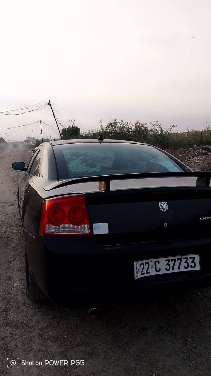 جارجر 2008 مكينه 3500 كير ومكينه خير من الله تخم تاير صدر زين تبريد شغال داخل لونين رقم اربيل  السيارة مصبوغه عام وبيها تبديل باب السائق السعر 85 وبيها مجال بسيط المكان بغداد سبع البور الرقم ***********

نص مكتوب في الصور:
- Shot on POWER P55