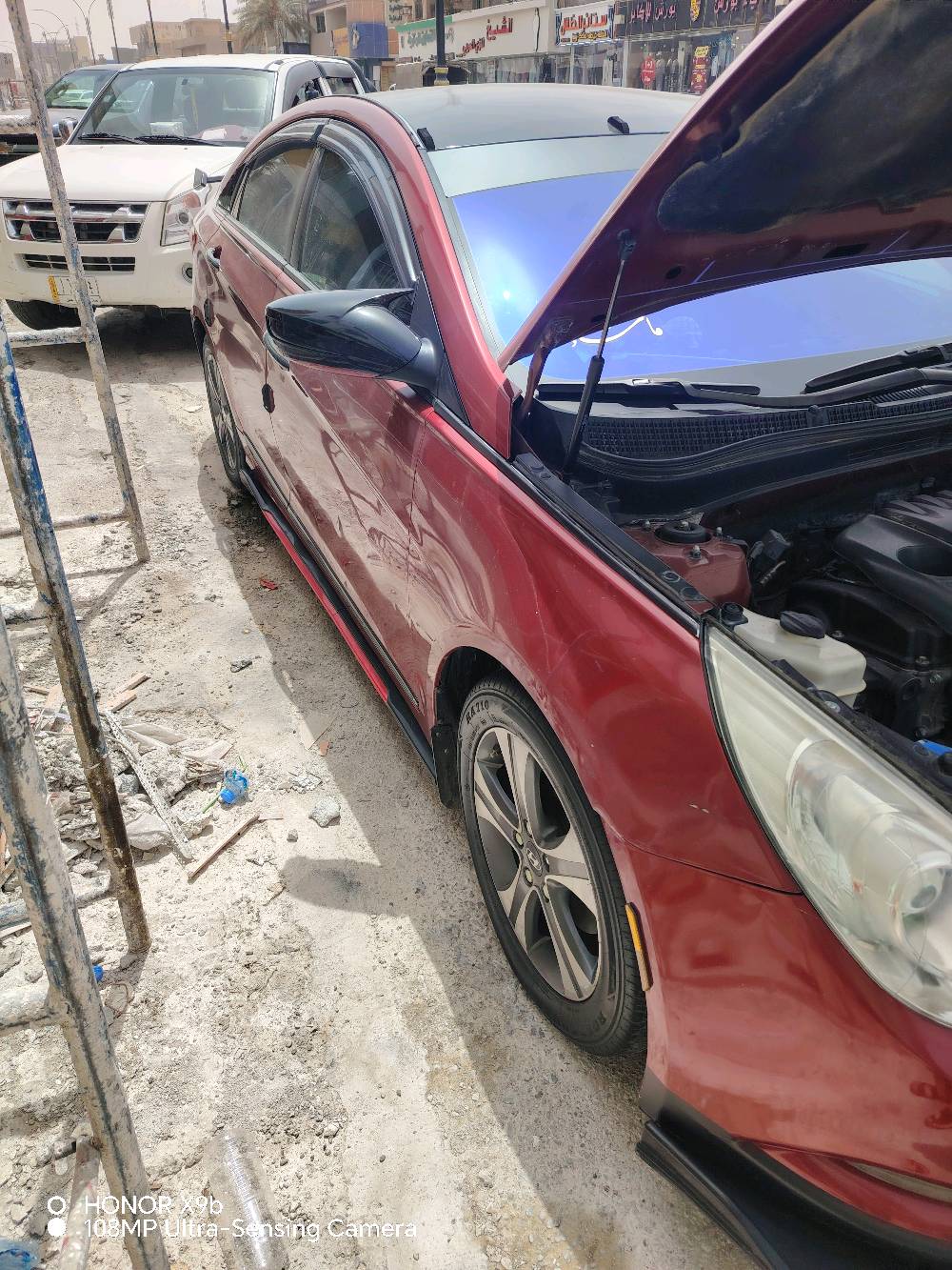 سوناتا موديل ٢٠١٣ وارد أمريكي بسمي شرط التحويل كير ومحرك خير من الله مكينه 2400 لون احمر ماروني مميز رقم كركوك تبريد تدفئه خير من الله