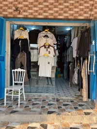 محل ملابس • بضاعة جملة • صوب الخسف