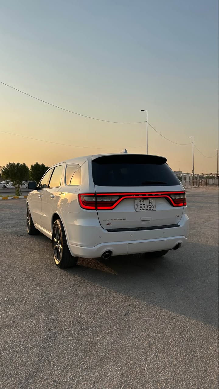 ‎دوج دورانكو ارتي 
Dodge Durango R/T   .
‎الموديل : 2021  . (وارد كندي كلين تايتل استيراد خاص زيرو) .
‎المحرك : V8 . 5.7L  .
‎العداد : 90 الف  .
‎السعر : 310 ورقه وبيه مجال بسيط
‎رقم بغداد
سيارة جاهزة ومصروف عليها اهواي ماعايزه برغي اخت الجديدة   .
‎المواصفات:  
‎* تحذير النقطة العمياء . 
‎* حساسات امامية وخلفية .
‎* شاحن هاتف لاسلكي (وايرلس ).
‎* فتحة سقف (سلايد) . 
‎* مقاعد من الجلد مع كنتارا الفاخر. 
‎* مقاعد كهربائية مع ذاكرة لحفظ وضعيات الجلوس. 
‎* مقاعد تبريد وتدفئة. 
‎* تدفئة مقود القيادة. 
‎* مقود رياضي مع تحكم كهربائي. 
‎* مصابيح امامية زنون مع LED .
‎* كشافات ضباب LED . 
‎* شاشة 10.1 أنج .
‎* نظام ملاحة (GPS) . 
‎* تشغيل عن بعد . 
‎* ويل قياس 20 أنج . 
‎* صندوق كهربائي . 
‎* بلوتوث تلفون .
‎* محدد سرعة . 
‎* كاميرا خلفية .
‎* كير شفتر ستيرنك .
‎* صف ثالث من المقاعد 7 راكب . 
‎* اطفاء وتشغيل اوتماتيكي Auto start . 
   للاستفسار *********** النجف, العراق
