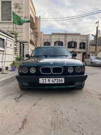 BMW ٥٢٥ مسكر عدله موديل ١٩٩١ رقم بغداد انكليزي لون زيتوني  بسمي بجم عر...
