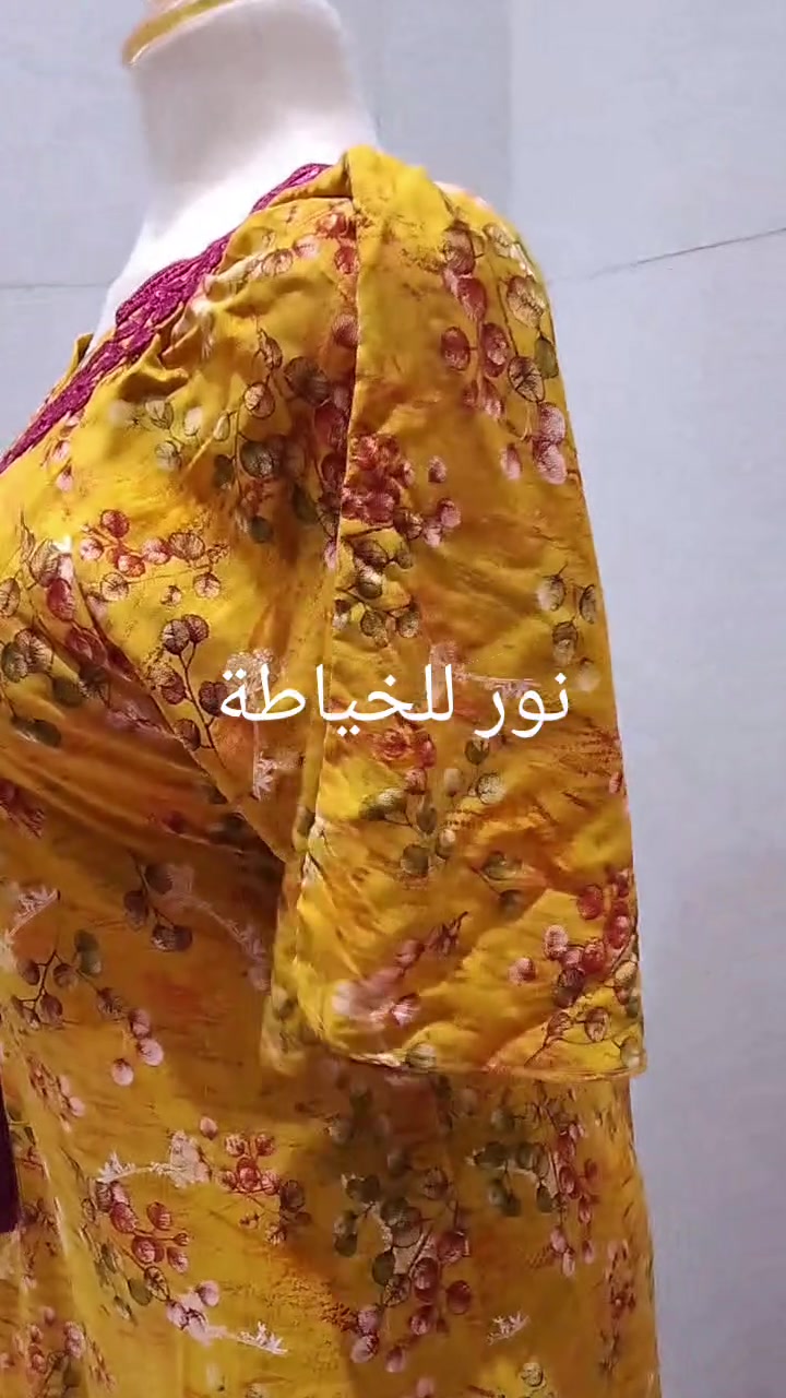 نور للخياطة • فستان مفصّل • أكمام منفوشة