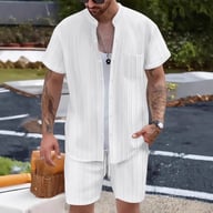 Man wearing white ribbed shirt and shorts set outdoors, casual style