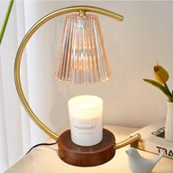Retro wax melting lamp with lit candle on bedside nightstand table