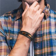 Man wearing tiger eye stone bracelet with casual shirt, everyday style