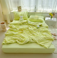 Double bed styled with light green breathable cooling quilt set