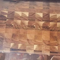 Wooden cutting board end-grain mosaic pattern close-up detail