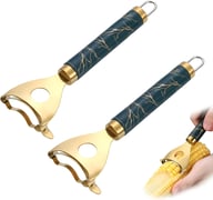 Two corn peeler tools with marble handles and fresh corn demonstration