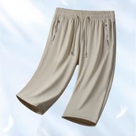 Close-up of adjustable drawstring waistband and zippered pocket detail
