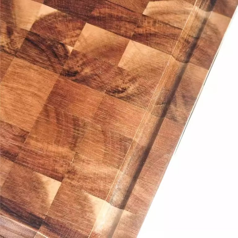 Full wooden cutting board with integrated handles and natural wood finish