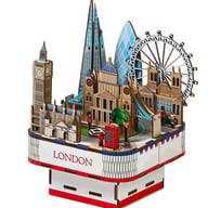 Close-up of laser-cut wooden puzzle pieces showing detailed architectural construction quality