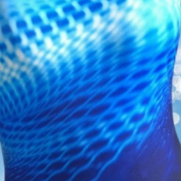 Close-up of blue ripple pattern and reinforced flatlock seams on swimsuit