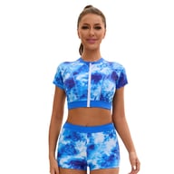 Front view of woman in blue tie-dye high-waist swimsuit with zipper top