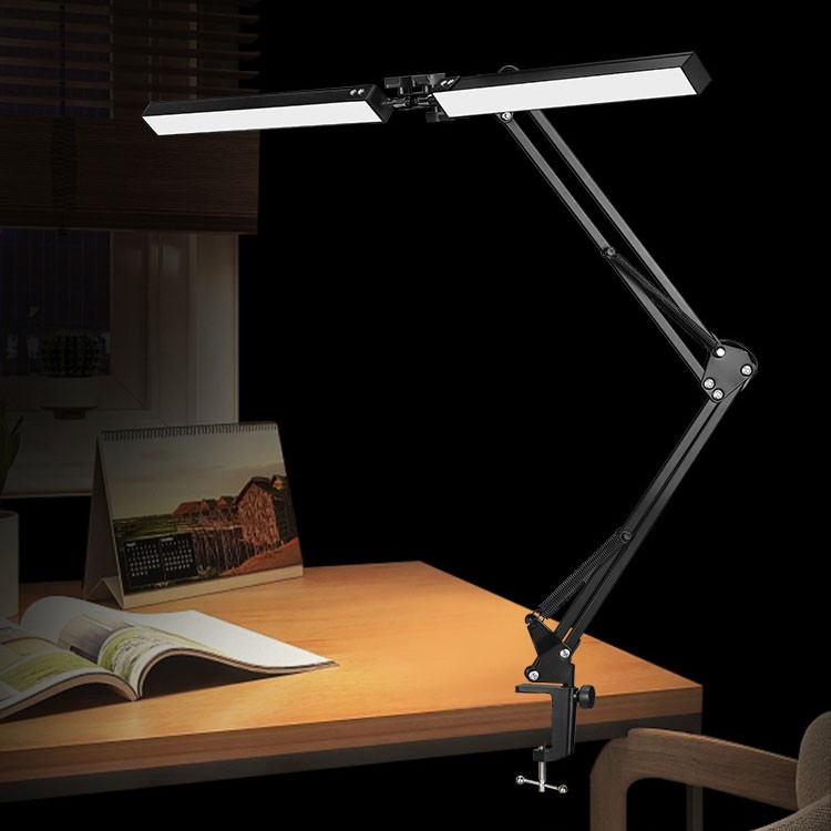 LED desk lamp clamped to desk edge, space-saving setup
