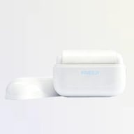 Self-cleaning pet hair removal tool button mechanism close-up
