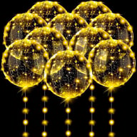 Group of glowing transparent LED balloons on black background party display