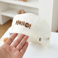 Children's embroidered smiling face beret in white, adjustable soft-top design