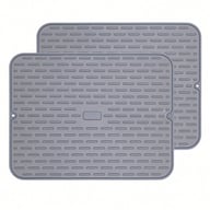 Two gray silicone drying mats stacked on white background showing flexibility