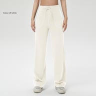 Front view woman wearing off-white elastic waistband fitness pants