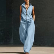Woman in light blue sleeveless stand collar two-piece set demonstrating breathable fabric comfort